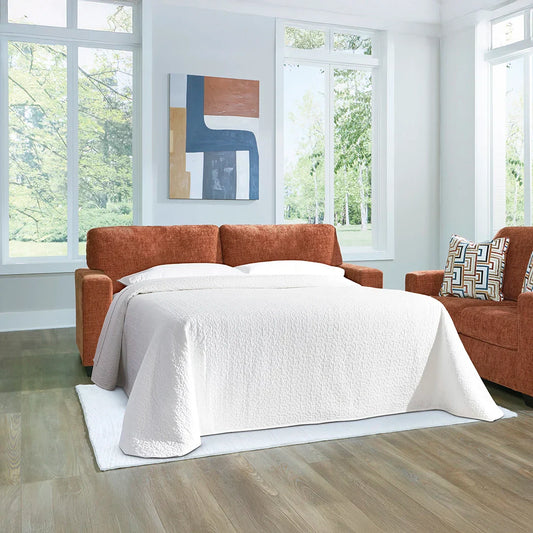 Navy blue sofa with bold accent pillows and playful modern style for living rooms